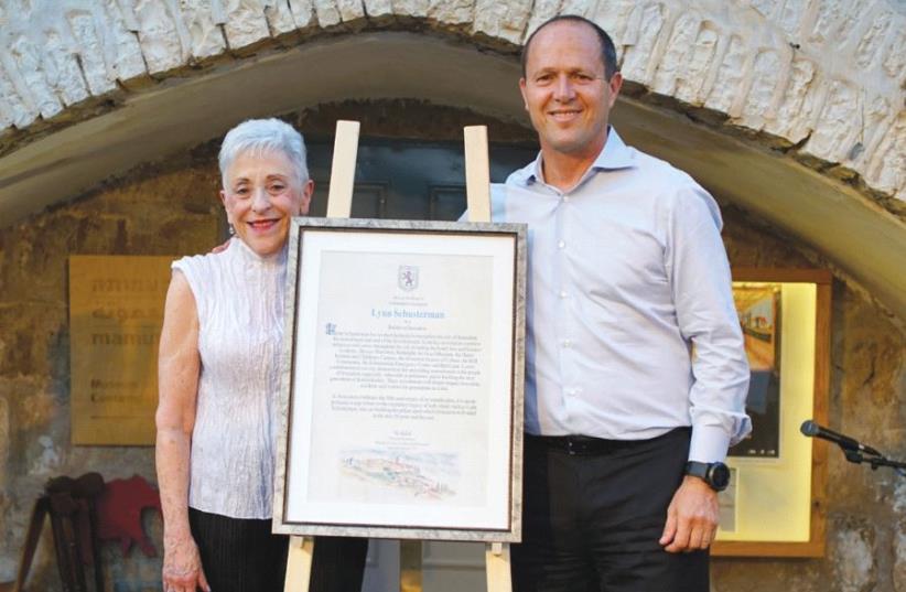 Mayor Nir Barkat presents the Jerusalem Builder Award to the Charles and Lynn Schusterman Foundation founder last week (photo credit: SNIR KAZIR)