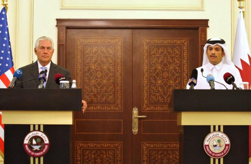 Qatar's foreign minister Sheikh Mohammed bin Abdulrahman al-Thani (R) and US Secretary of State Rex Tillerson attend a joint news conference in Doha, Qatar, July 11, 2017 (photo credit: REUTERS)