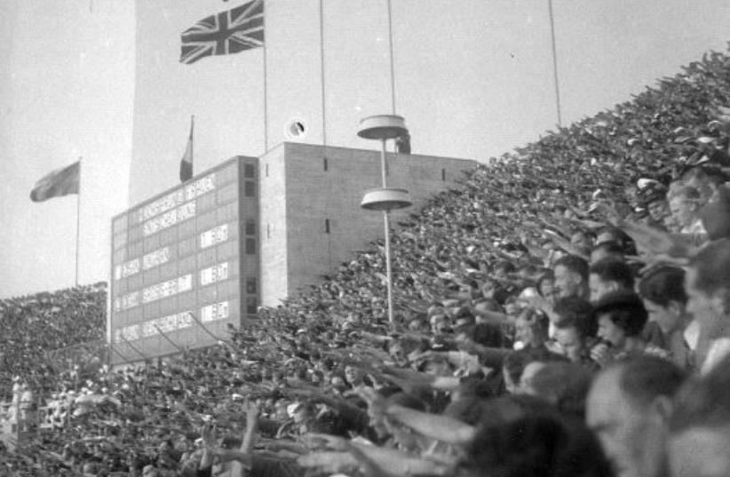 Spectators giving the Nazi salute during one of the 1936 Berlin Summer Olympics medal ceremonies (photo credit: FOTO:FORTEPAN / LŐRINCZE JUDIT VIA CC BY-SA 3.0)