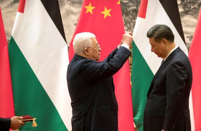 China's Xi Jinping and PA president Mahmoud Abbas in China, July 2017 (photo credit: REUTERS)