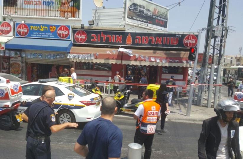 Scene of stabbing attack in Petah Tikva (photo credit: ALON HACHMON)