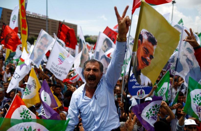 Pro-Kurdish demonstrators attend a rally as they shout slogans in Istanbul, Turkey, June 5, 2016.  (photo credit: REUTERS)