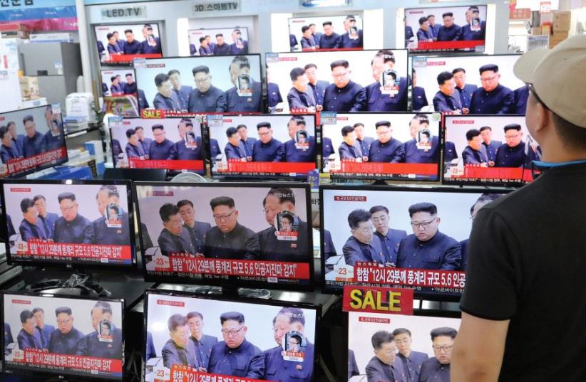 A MAN watches images of North Korean’s leader on September 2nd in Seoul, South Korea. (photo credit: REUTERS)