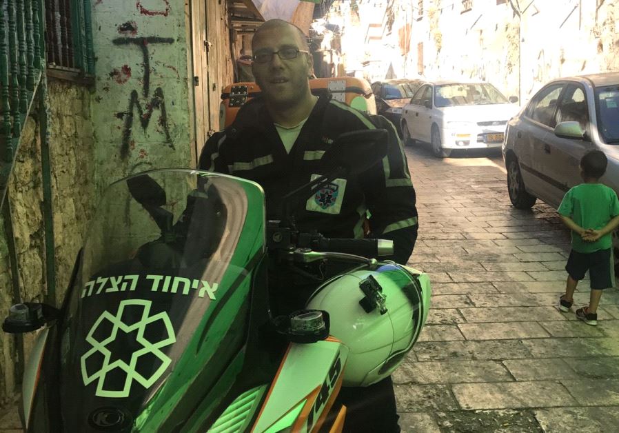 Nedal Sader with his ambucycle in Jerusalem's Old City (credit: Courtesy -  United Hatzalah)