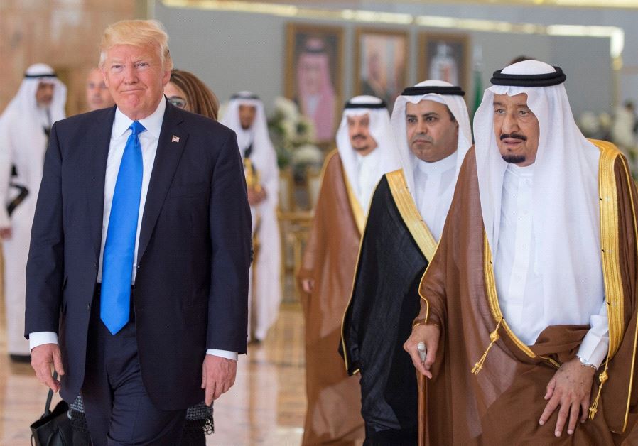 Saudi Arabia's King Salman bin Abdulaziz Al Saud walks with US President Donald Trump during a reception ceremony in Riyadh, Saudi Arabia, May 20, 2017