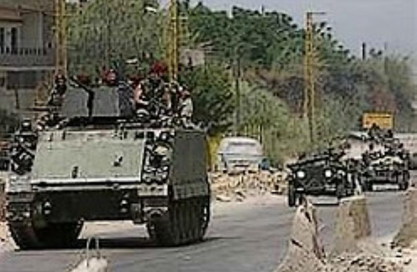 Lebanese Armed Forces troops on armored personnel  (photo credit: AP)