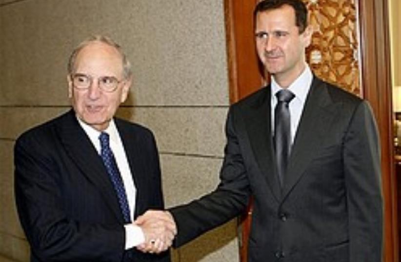 US Mideast envoy George Mitchell shakes hands with (photo credit: AP)