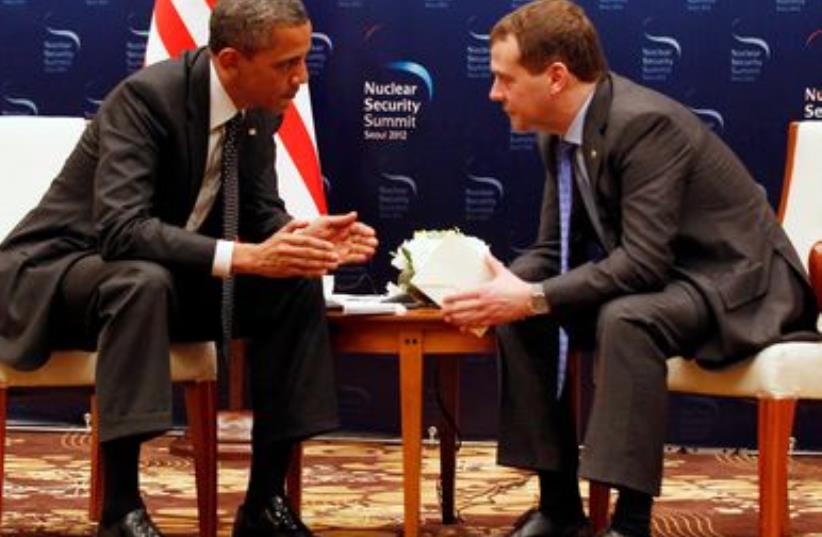 Obama was whispering to Russian President Medvedev