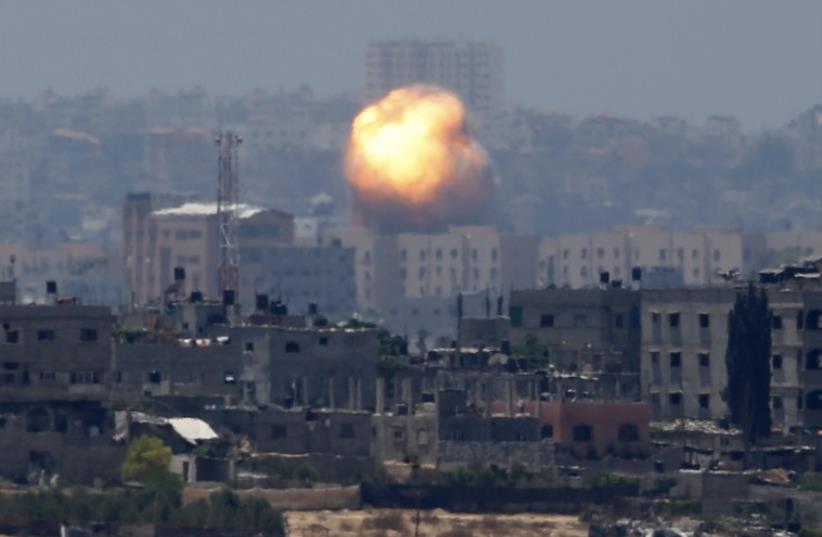 An explosion is seen after an air strike in northern Gaza (photo credit: REUTERS)