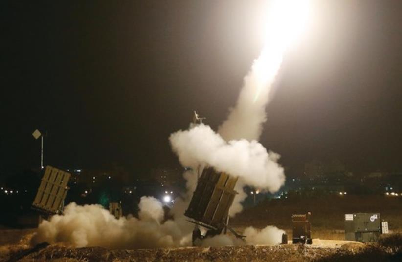 An iron dome launches rockets to intercept incoming rockets from Gaza on Tuesday. (photo credit: REUTERS)