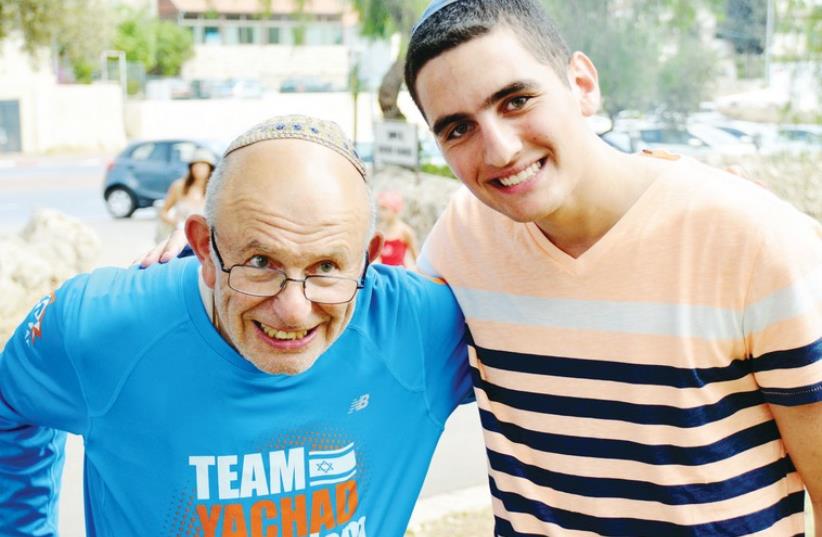 Yehuda Berren with Menachem Kashanian, a volunteer for Yachad, an organization that strives to include the disabled in Jewish communal life. (photo credit: LISA GALINSKY)