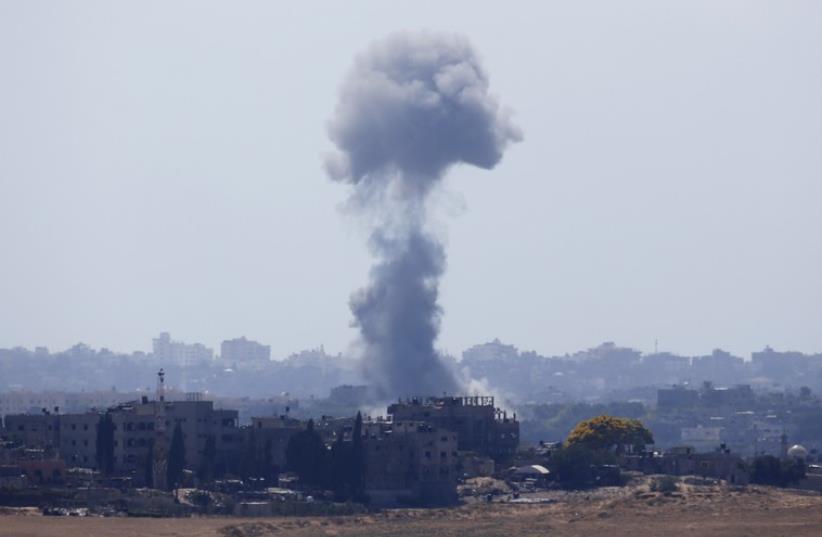 Smoke rises after an explosion in the northern Gaza Strip (photo credit: REUTERS)