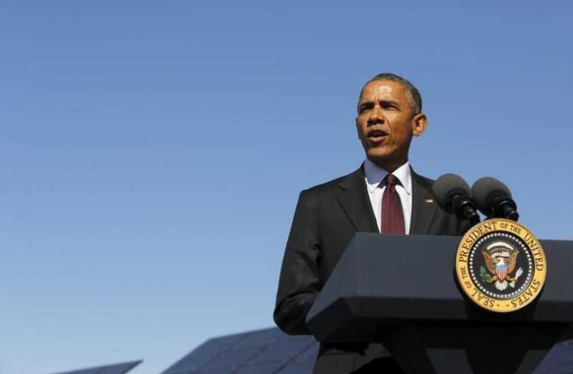 US President Barack Obama delivers remarks on clean energy after a tour of a solar power array at Hill Air Force Base, Utah (photo credit: REUTERS)