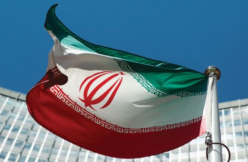 AN IRANIAN flag flutters in the breeze (photo credit: REUTERS)