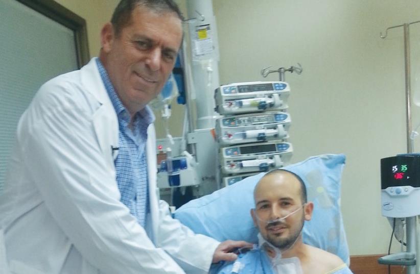 PROF. DAN ARAVOT visits his patient, Ran Azulai (photo credit: RABIN MEDICAL CENTER)