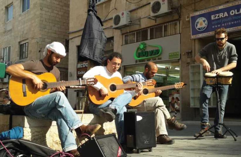 A guitar band performs on Ben-Yehuda Street. (photo credit: GAVRIEL FISKE)