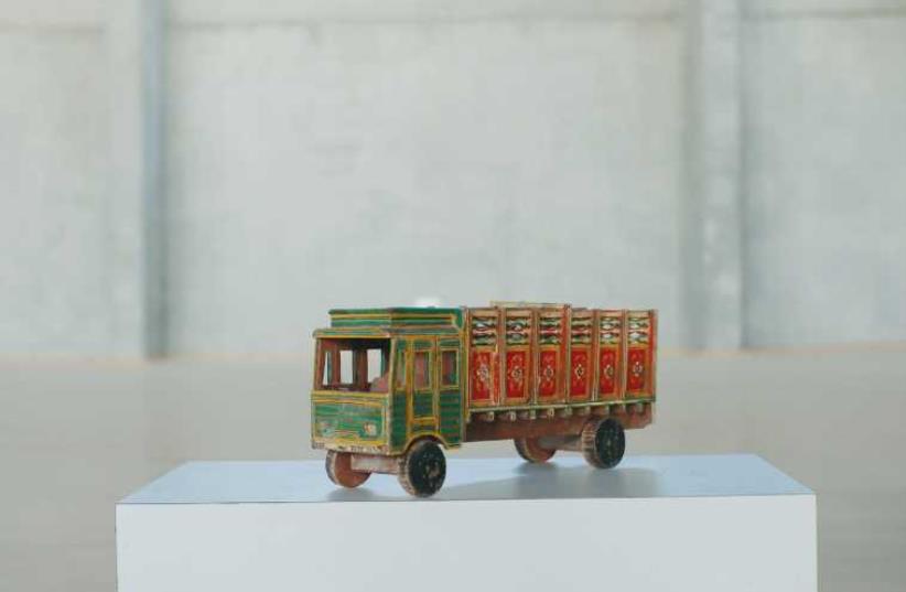 This colorful wagon is on display in the Hana Hertsman-curated exhibition. (photo credit: REUTERS)