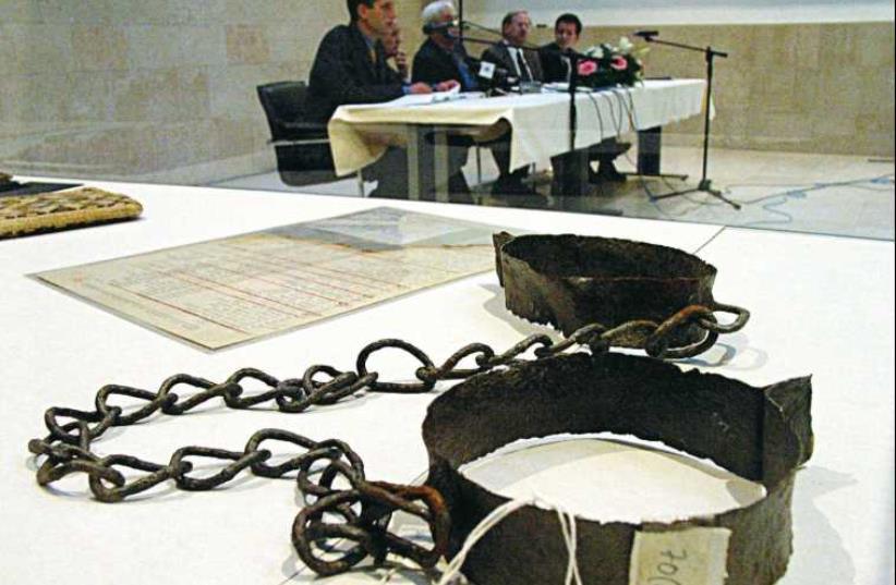 Original chains and manacles worn by inmates of World War II Jasenovac concentration camp displayed at Jasenovac, Croatia, in 2001. (photo credit: REUTERS)