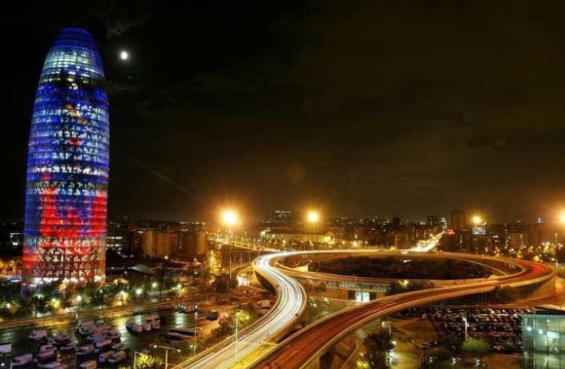 The Agbar Tower (L) in Barcelona (photo credit: REUTERS)