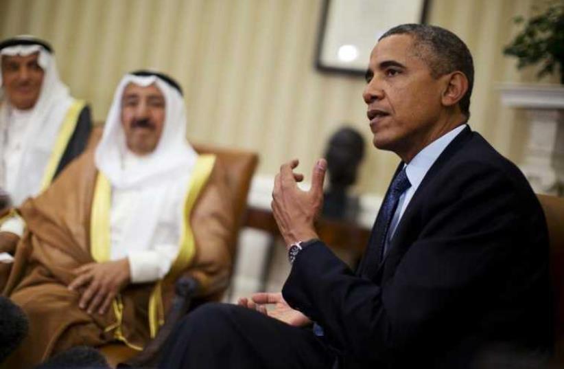 US President Barack Obama meets Sheikh Sabah al-Ahmad al-Jaber al-Sabah, Kuwait's emir, in the Oval Office of the White House in Washington (photo credit: REUTERS)