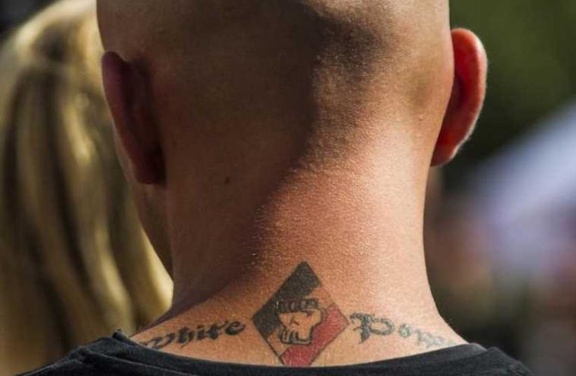 A white power tattoo is seen at a far-right wing summer festival in the German village of Viereck (photo credit: REUTERS)