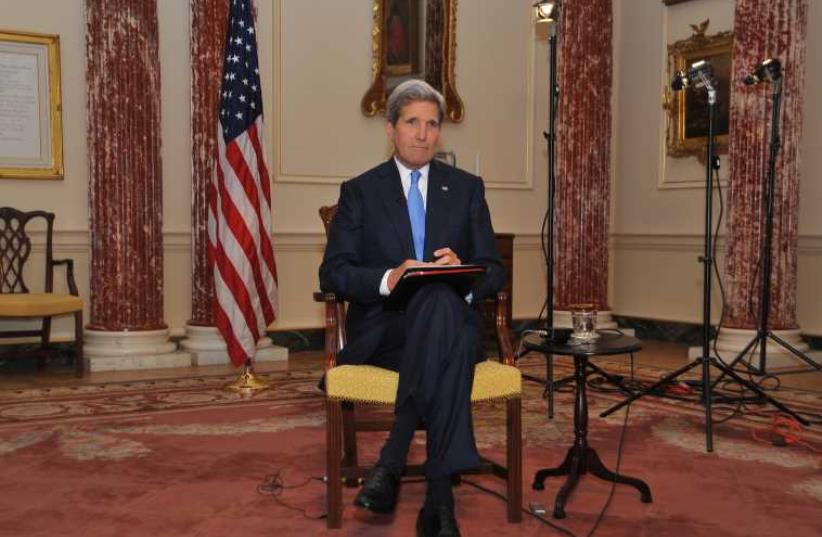 US Secretary of State John Kerry prepares for a television interview in Washington (photo credit: STATE DEPARTMENT PHOTO)