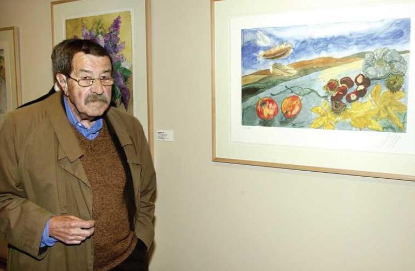 German writer Günter Grass stands next to one of his worksof art as he inaugurates an exhibition at Goya’s birthplace in Spain in 2004 (photo credit: REUTERS)