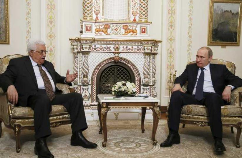 Palestinian Authority President Mahmoud Abbas meets Vladimir Putin on official visit to Russia (photo credit: REUTERS)