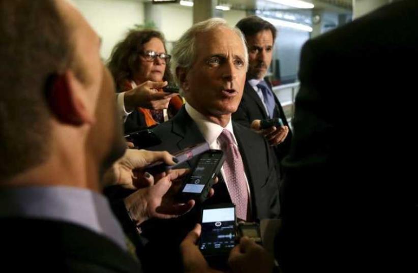 Senate Foreign Relations Committee Chairman Senator Bob Corker (R-TN) (C) talks to reporters on Capitol Hill in Washington (photo credit: REUTERS)