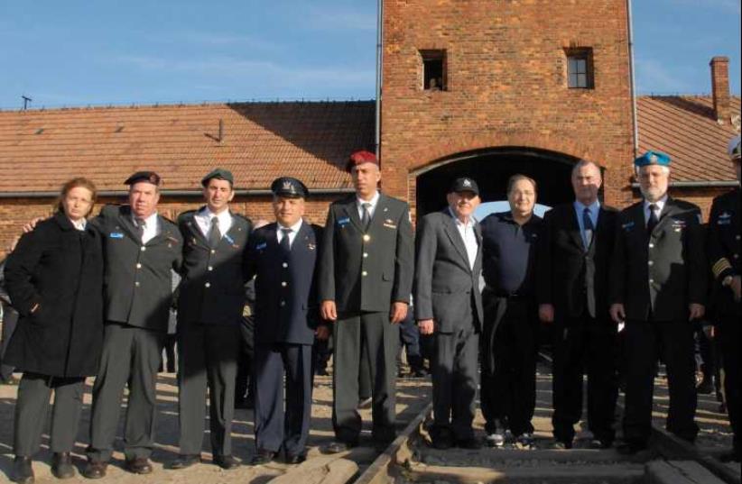 Abe Foxman with an IDF delegation at Auschwitz. (photo credit: IDF SPOKESMAN'S OFFICE)