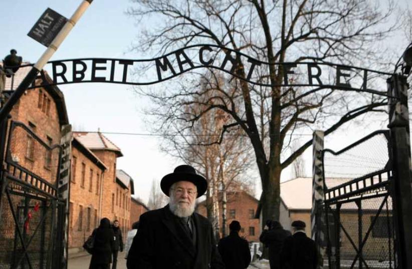 Rabbi Yisrael Meir Lau stands at the gates of Auschwitz. (photo credit: REUTERS/MICHAL LEPECKI)