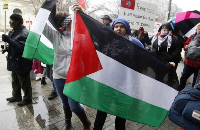 Anti-Israel demonstrators hold a rally in Washington, on March 1. (photo credit: JONATHAN ERNST / REUTERS)