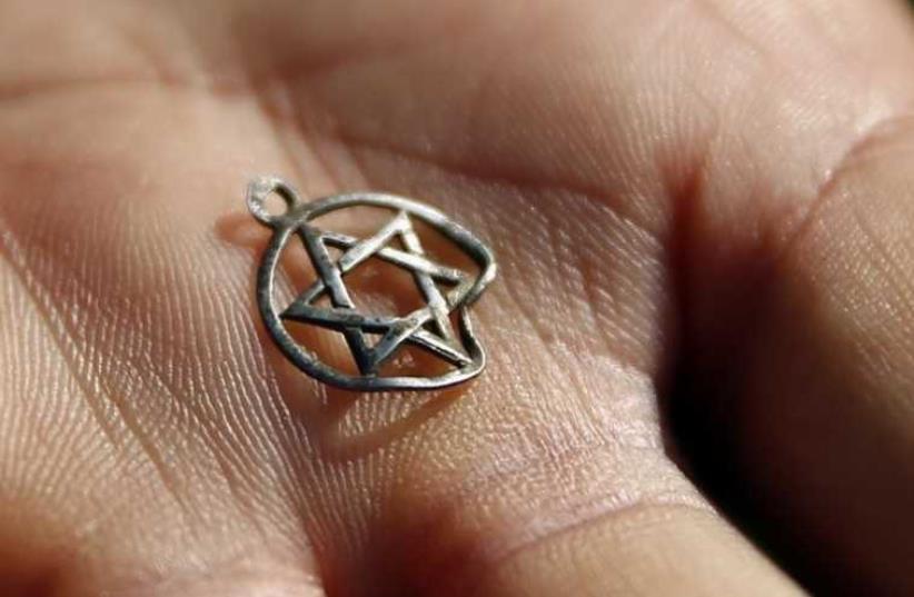 A medallion in the shape of the Star of David (photo credit: REUTERS)