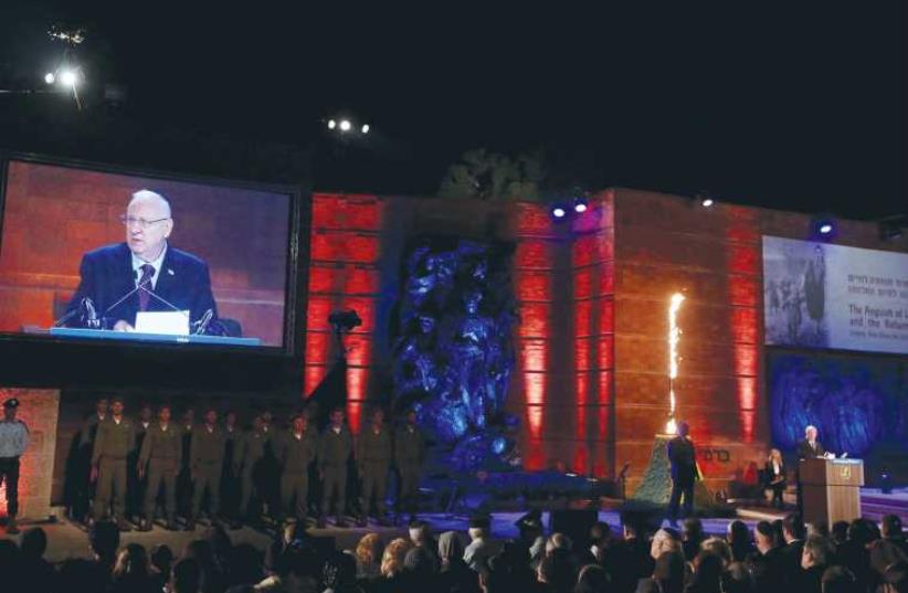 PRESIDENT Reuven Rivlin addresses the opening ceremony of Holocaust Martyrs and Heroes Remembrance Day at Yad Vashem in Jerusalem last night. (photo credit: MARC ISRAEL SELLEM/THE JERUSALEM POST)