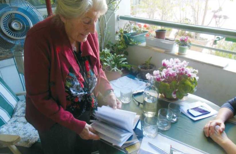 Betty Bausch with her memoir, ‘Broken Silence.’ (photo credit: ARIEL COHEN)