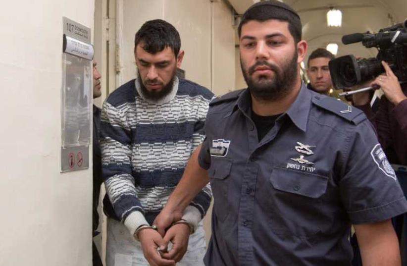 Khaleed Kutina arrives in court April 16, 2016 (photo credit: MARC ISRAEL SELLEM/THE JERUSALEM POST)
