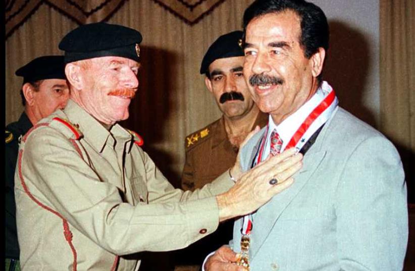 Izzat al-Douri with late Iraqi President Saddam Hussein (photo credit: REUTERS)