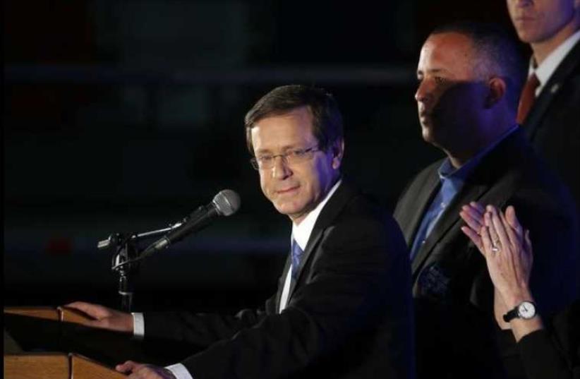 Zionist Union chief Isaac Herzog delivers a speech to supporters (photo credit: REUTERS)