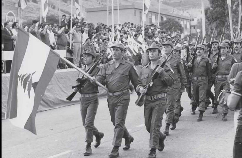 A unit from the South Lebanon Army marches in a Yom Ha’atzmaut parade in Kiryat Shmona in 1982. (photo credit: HERZ/JERUSALEM POST ARCHIVES)