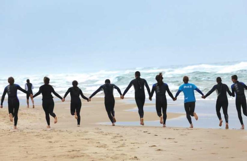 HaGal Sheli in Tel Aviv and Bat Yam teaches at-risk youth how to surf. (photo credit: YANAI YECHIEL)