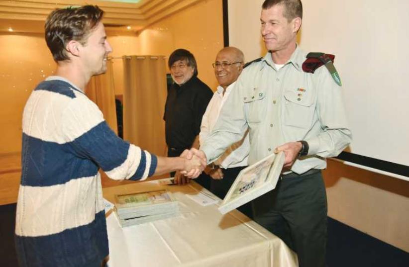 Daniel Wein accepts his award from Brig.-Gen. Avner Paz-Tzuk.  (photo credit: Courtesy)