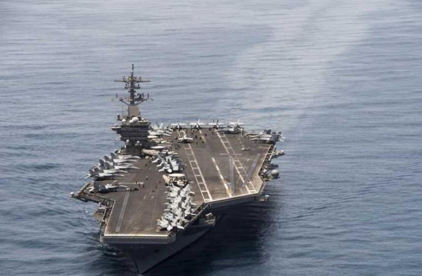 The aircraft carrier USS Theodore Roosevelt operates in the Arabian Sea conducting maritime security operations in this US Navy photo taken April 21, 2015. (photo credit: REUTERS)