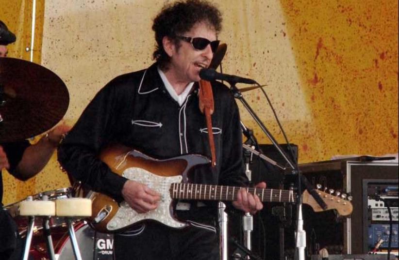 Bob Dylan performs with his band at the 34th annual New Orleans Jazz and Heritage Festival, April 25, 2003.  (photo credit: REUTERS)