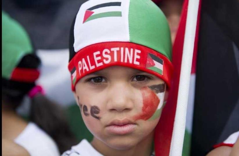 A boy attends a pro-Palestinian demonstration in Berlin (photo credit: REUTERS)