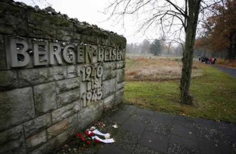 A memorial stone is pictured at the former Bergen-Belsen Nazi death camp (photo credit: REUTERS)