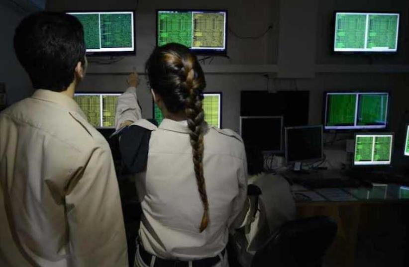 Operators in the Israel Navy cyber control room (photo credit: IDF SPOKESPERSON'S UNIT)