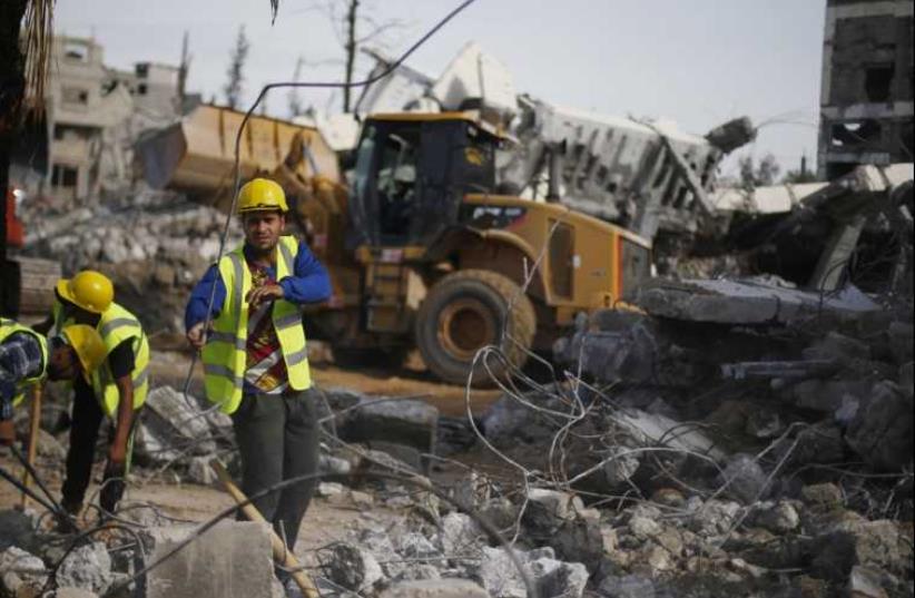 Clearing the rubble east of Gaza City (photo credit: SUHAIB SALEM / REUTERS)