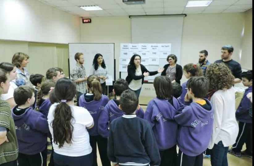 Pardes students give a lesson on Passover in Edirne. (photo credit: Courtesy)