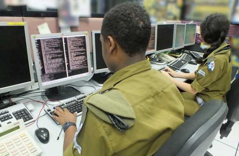 IDF's Center of Computing and Information Systems; soldiers with computers.  (photo credit: IDF)