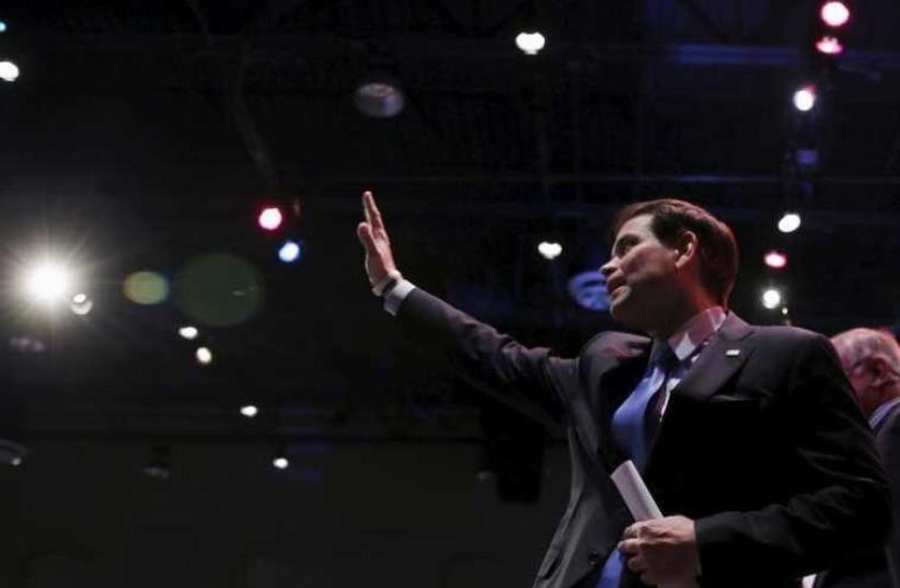 US presidential candidate and Republican senator of Florida Marco Rubio acknowledges the applause of the audience after speaking at the Iowa Faith and Freedom Coalition's forum in Waukee, Iowa (photo credit: REUTERS)
